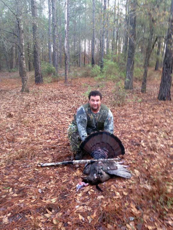 Lucky Hunter shows off his turkey